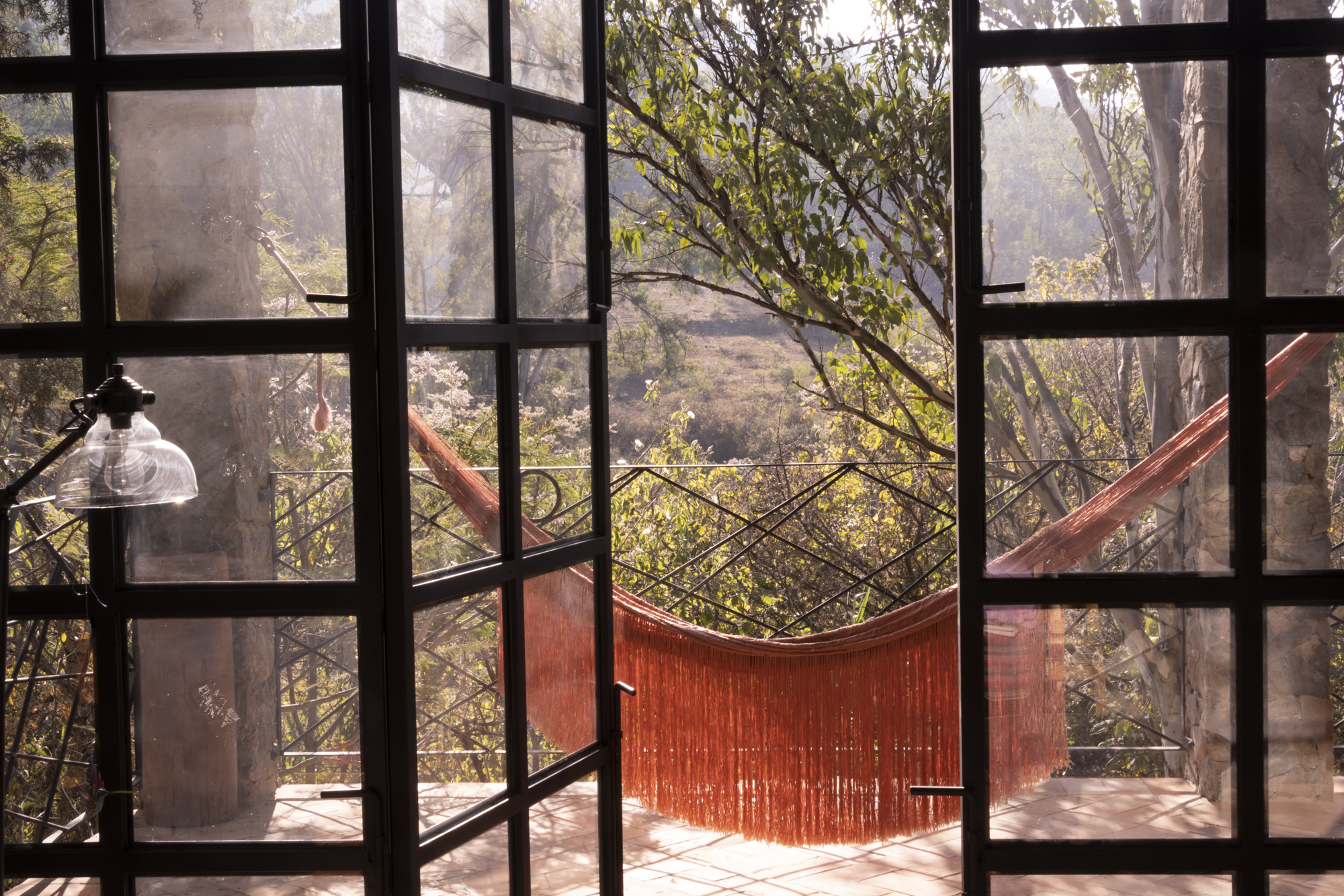 Detail of balcony with iron landscape drawings and hamaca