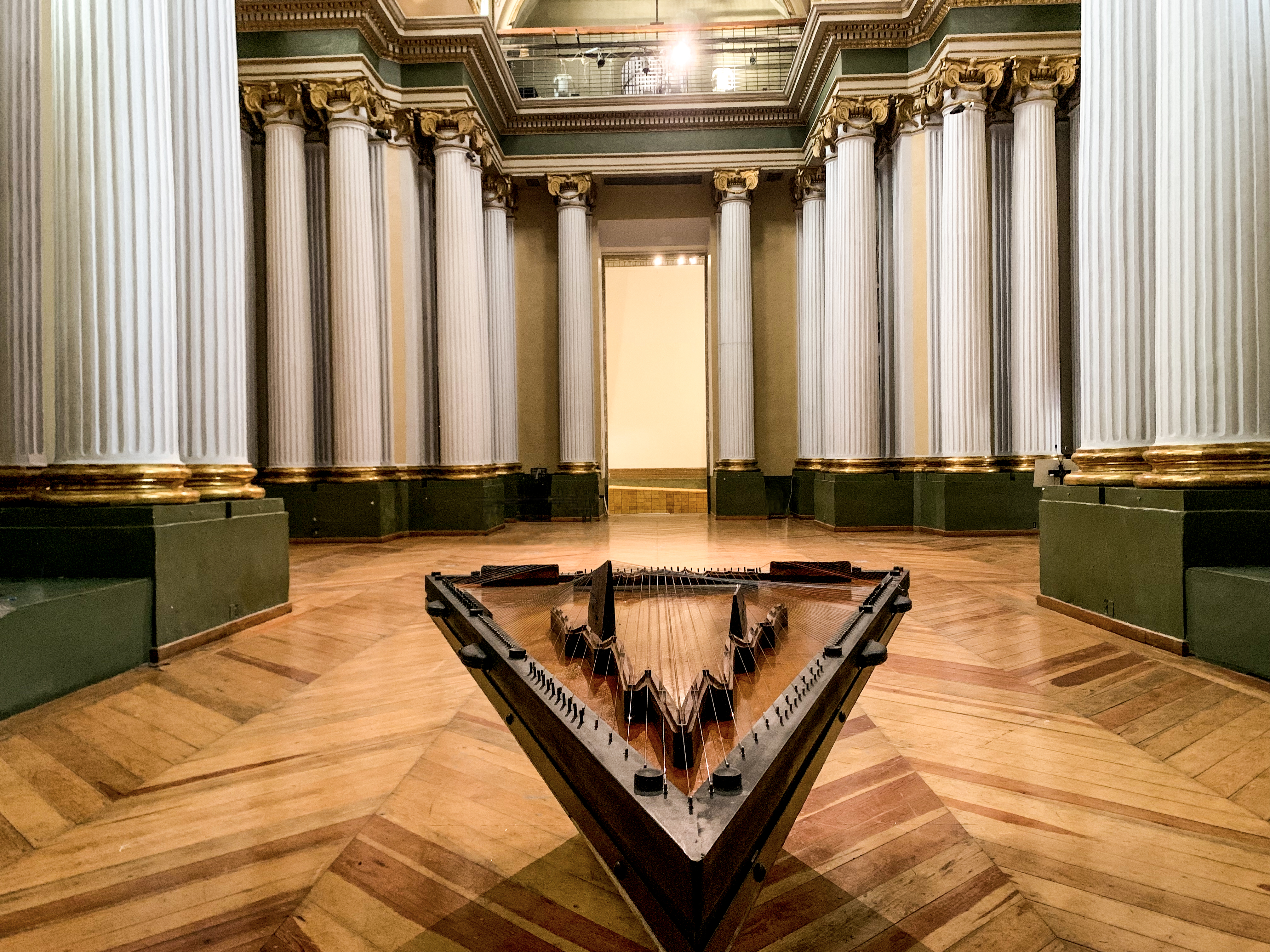 Citrapataṃga Brevicornis, 2022.  
Concept: Ximena Labra, Leonardo Heiblum. Collaboration with luthier Carlos Chinchillas.

Musical instrument for twelve hands, sound sculpture. Harmonic table: cedar wood with carved chagane wood bridges. 108 strings: piano, concert harp, Jarocha harp, jarana, sitar and psaltery strings. Body: chechen and katalox woods. Iron and steel. 
2.7 x 1.8 x 1.3 m 
